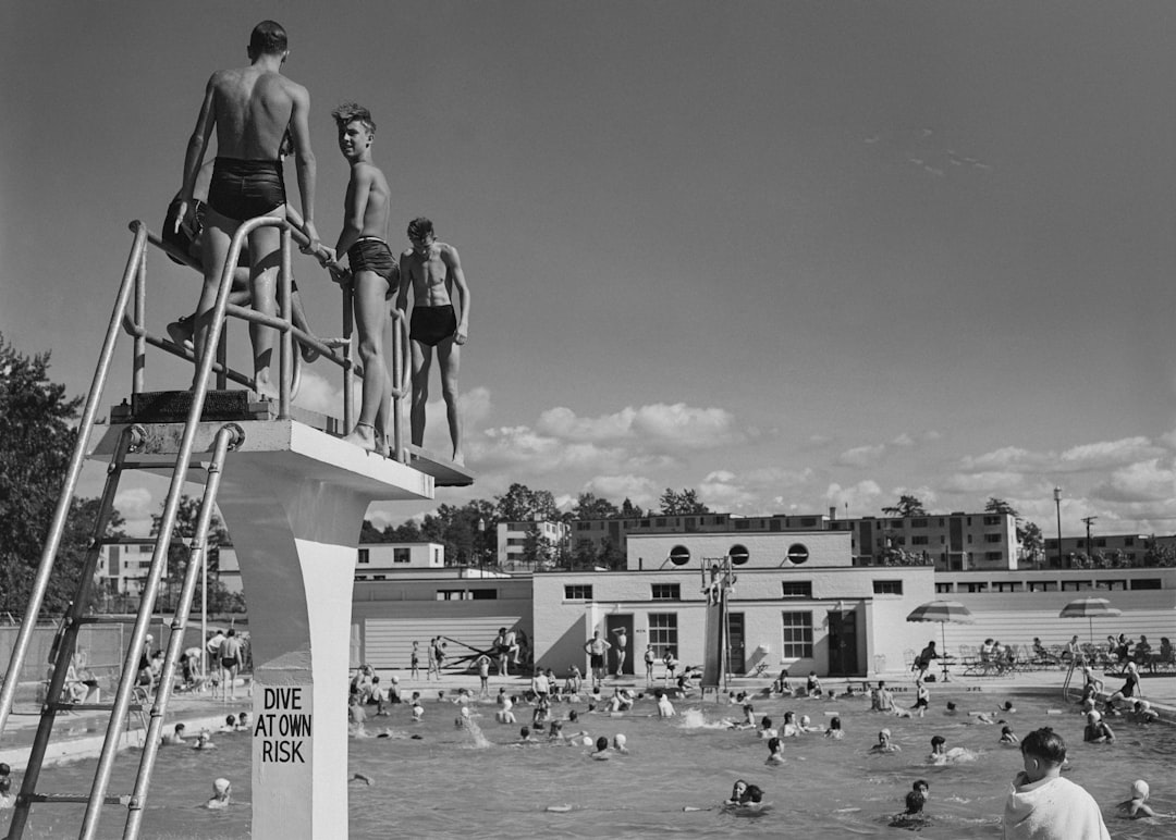 2 boys in swimming pool during daytime