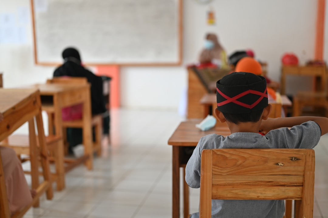 Children in a classroom with numbers on the wall