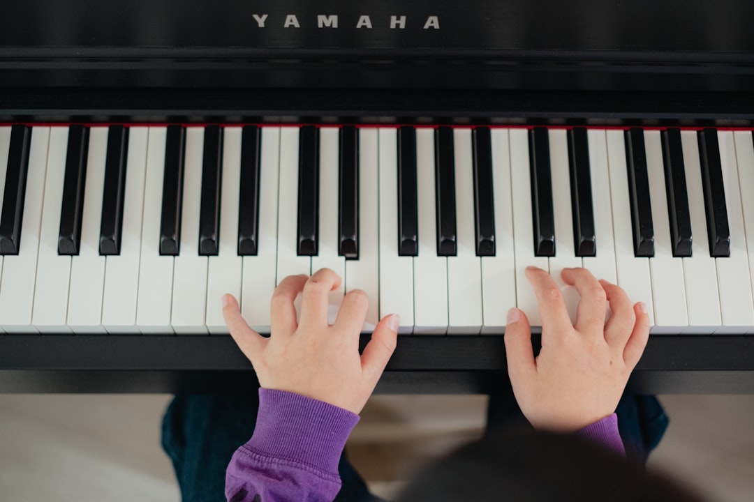 woman playing Yamaha piano
